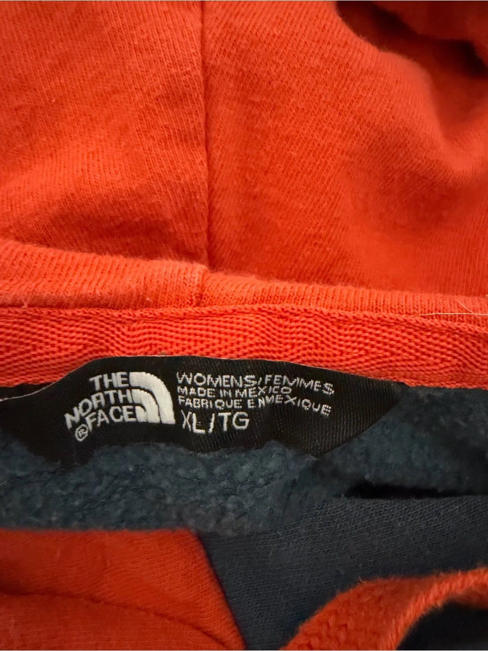 The North Face Blue Pullover Hoodie with Orange Hood and Drawstrings